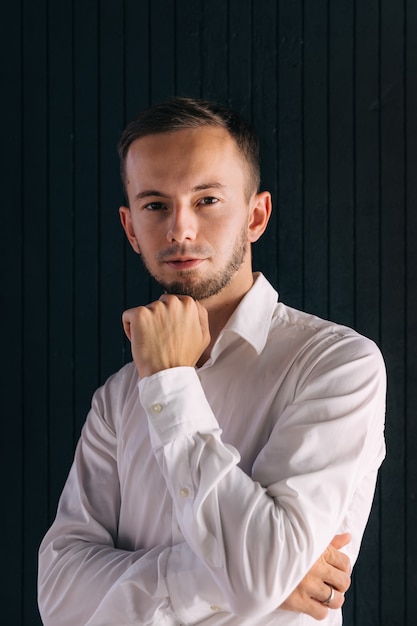 Handsome man with beard wearing white shirt