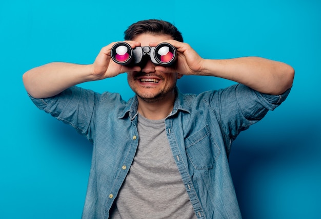 Handsome man with binoculars