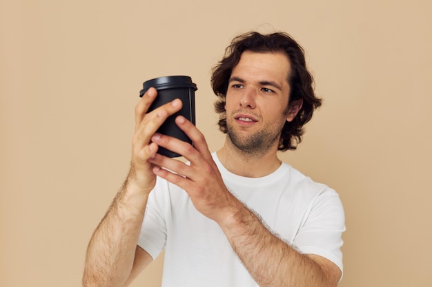 Handsome man with a black glass in a white tshirt isolated background