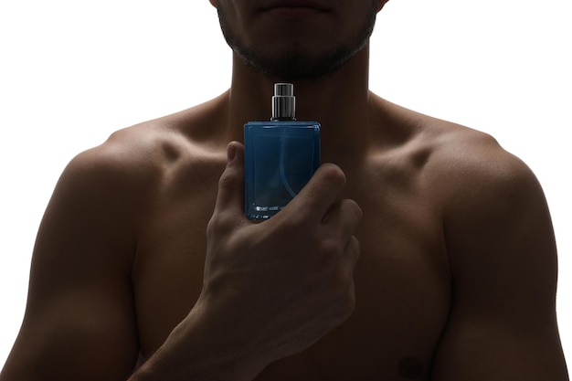 Photo handsome man with bottle of perfume on white background closeup