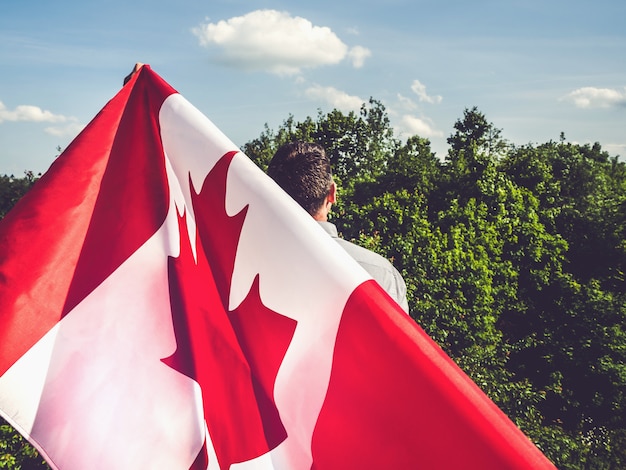 Handsome man with Canadian flag