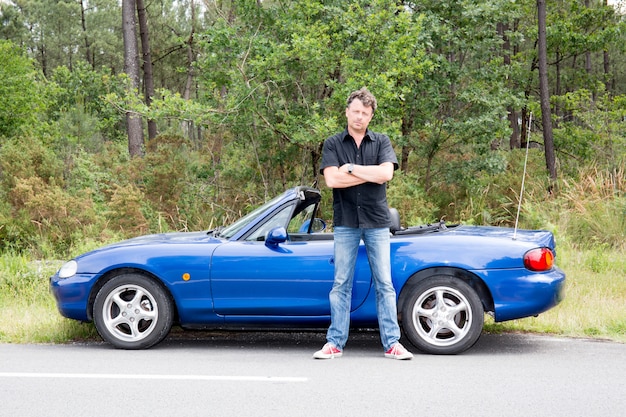 Handsome man with a car