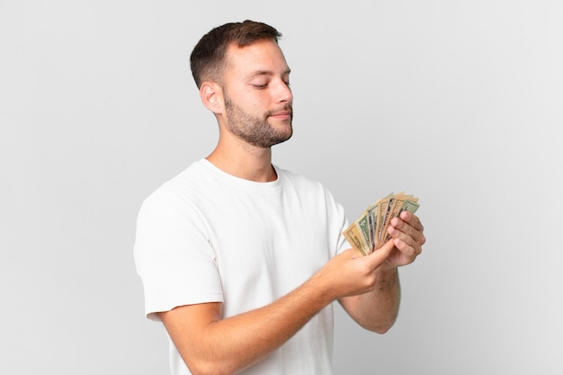 Handsome man with dollar banknotes