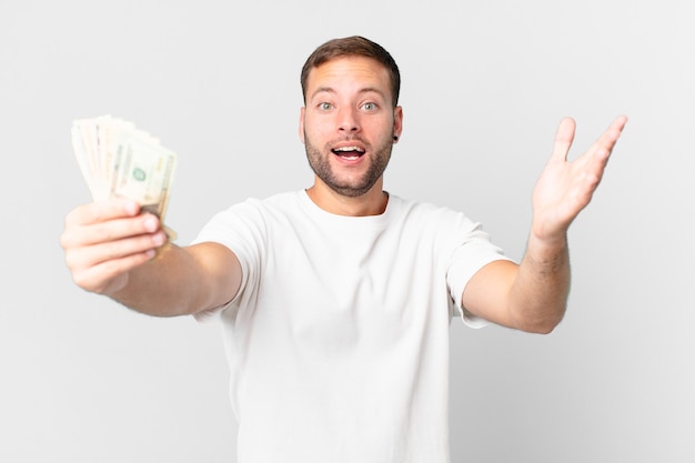 Handsome man with dollar banknotes