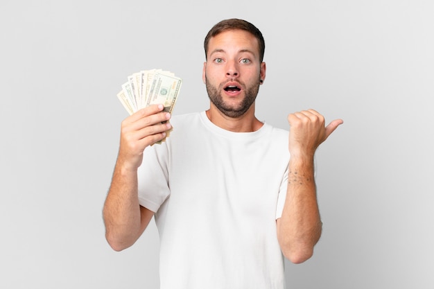 Handsome man with dollar banknotes