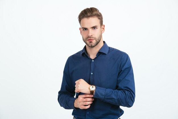 Handsome man with groomed hair. businessman with wristwatch. trendy men with wrist watch isolated on white. male fashion accessory. concept of time. guy checking time. unshaven business man.