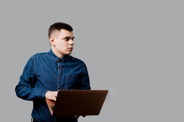 Handsome man with laptop. Business man working online at home.