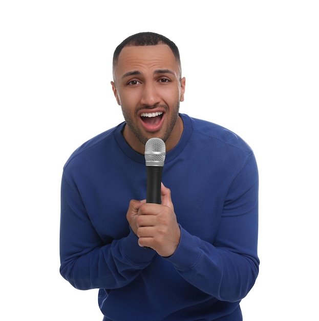 Photo handsome man with microphone singing on white background