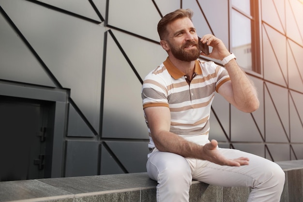 handsome man with mobile phone outdoor