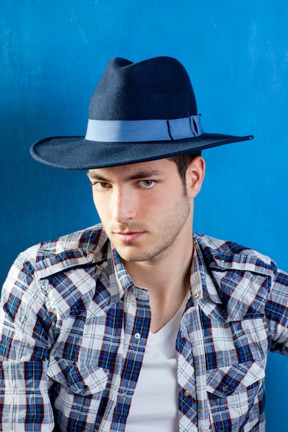 handsome man with plaid shirt and cowboy hat