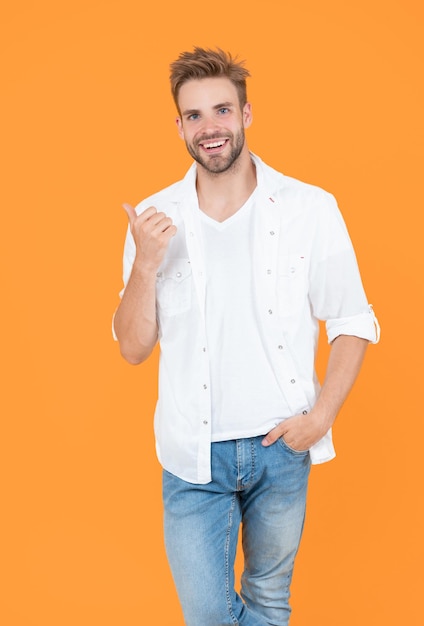 Handsome man with stubble isolated on yellow handsome man with stubble in studio