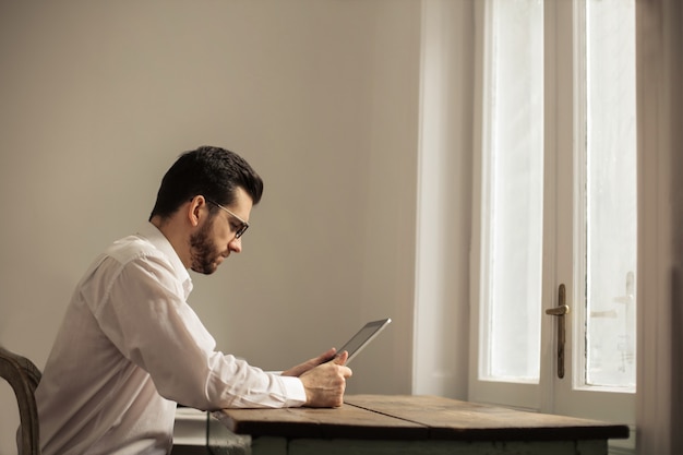 Handsome man with a tablet