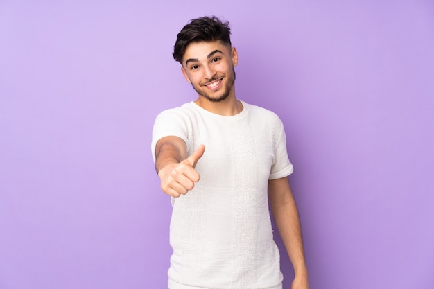 handsome man with thumbs up because something good has happened