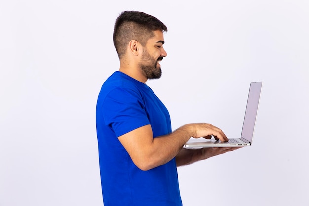 Handsome man working online using his laptop