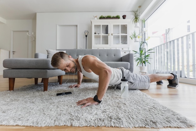 Handsome man working out at home