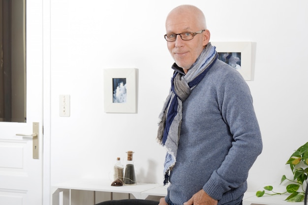 Handsome mature man with blue pullover