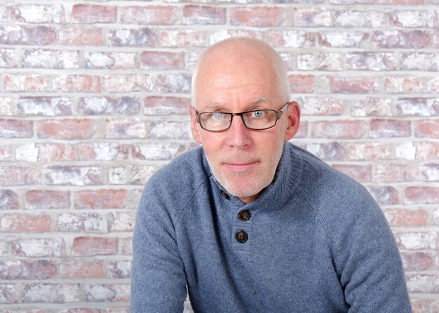 Handsome mature man with blue pullover