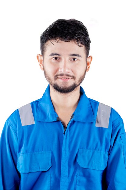 Handsome mechanic looking and smiling at camera