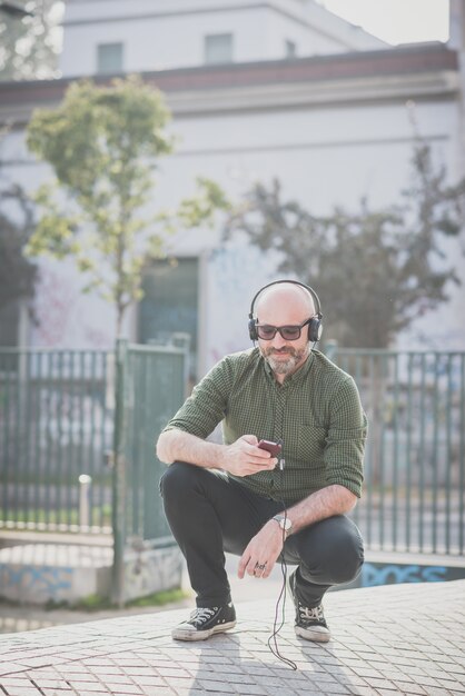 handsome middle aged man listening music