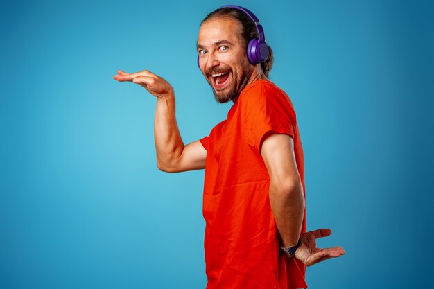 Handsome middle-aged man listening to music