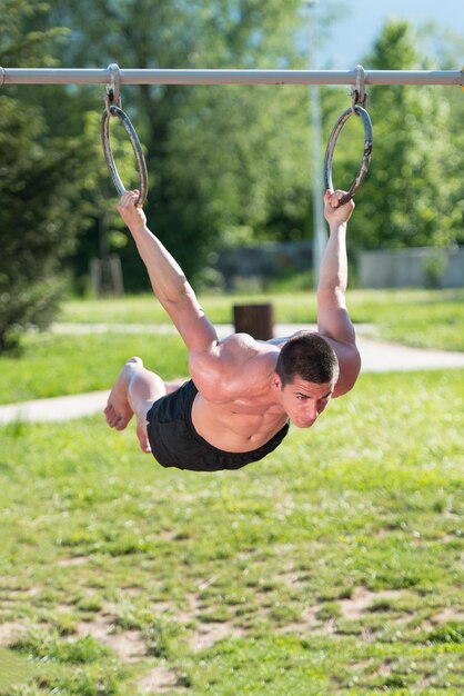 Handsome Muscular Young Man Workout In The Park