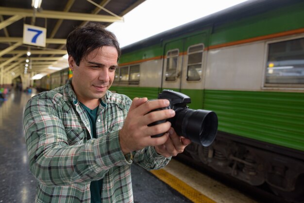 Handsome Persian tourist man at the railway station in Bangkok