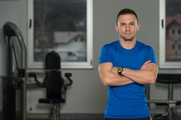 Handsome Personal Trainer Wearing Sportswear In Fitness Center