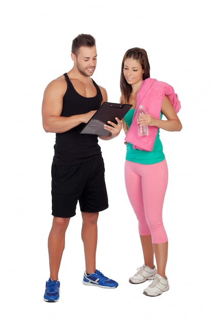 Handsome personal trainer with a attractive girl