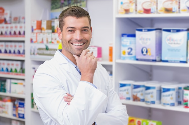 Handsome pharmacist smiling at camera