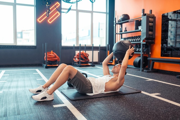 Handsome serious man working out in the sports center