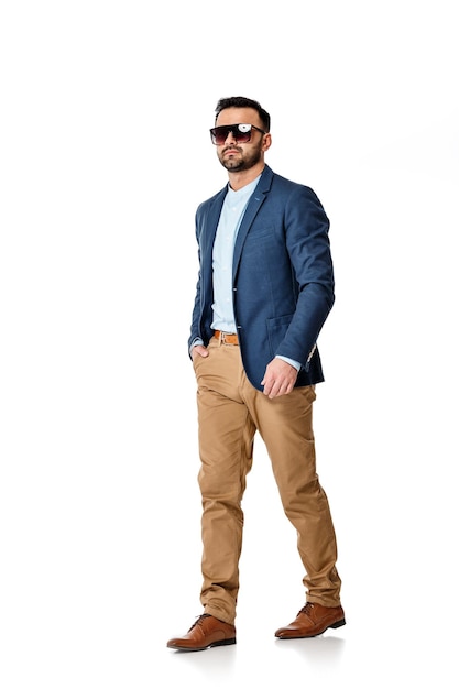 Handsome sexy man in sunglasses and suit on white background