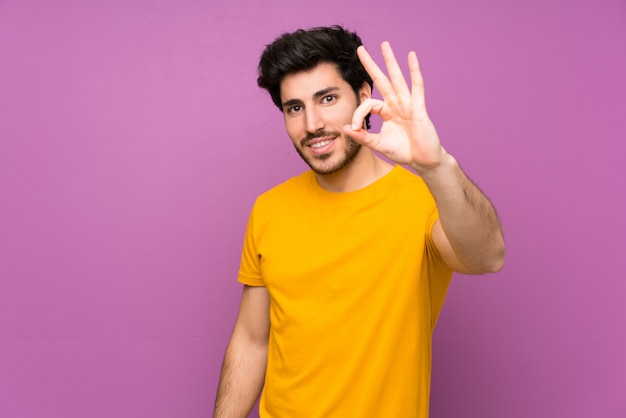 Handsome showing ok sign with fingers