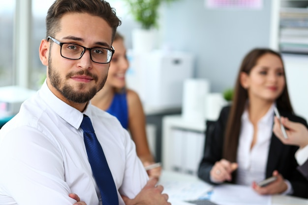 Handsome smiling bearded clerk man wearing glasses