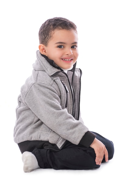 Handsome Smiling Boy Sitting Isolated