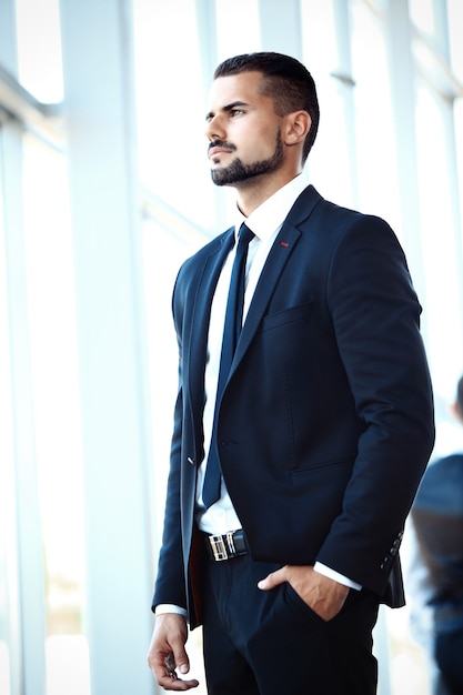 Handsome smiling confident businessman portrait