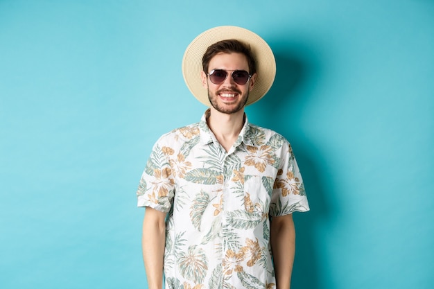 Premium Photo | Handsome smiling guy in sunglasses and summer shirt ...