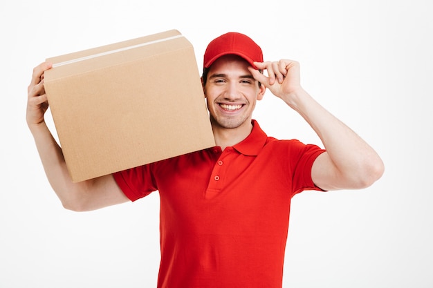 Photo handsome smiling young delivery man