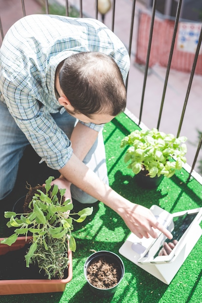 handsome stylish man gardening