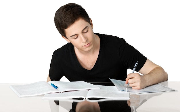 Handsome Teenager studying over blurred background