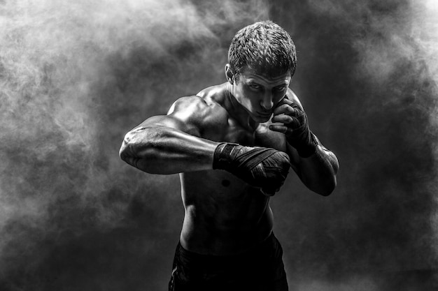 Photo handsome topless sportsman practicing punches