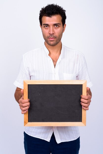  handsome Turkish man against white wall