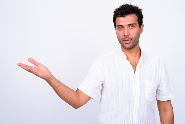  handsome Turkish man against white wall