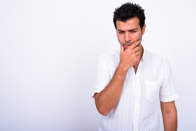  handsome Turkish man against white wall