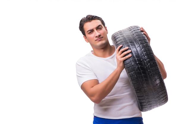 Handsome tyre repairman isolated on white