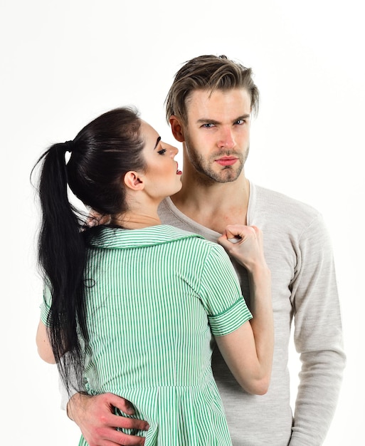 Handsome unshaven man and pretty girl in love Valentines day and love Romantic feelings concept Romantic couple in love hug Man and woman couple in love cuddle or hug on white background