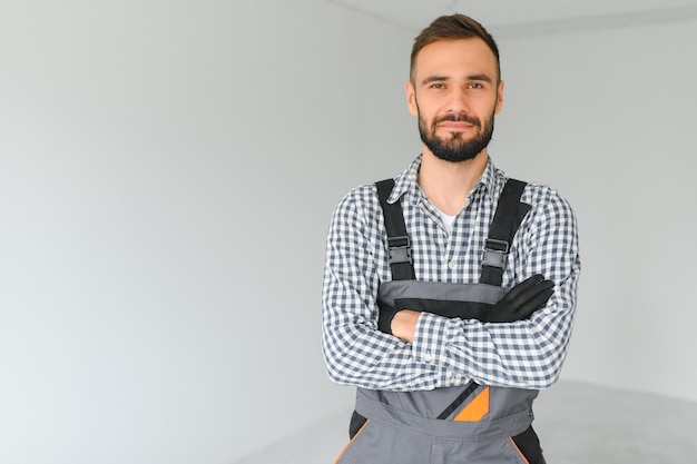 Handsome worker in empty room