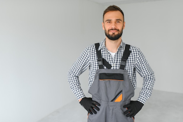 Handsome worker in empty room