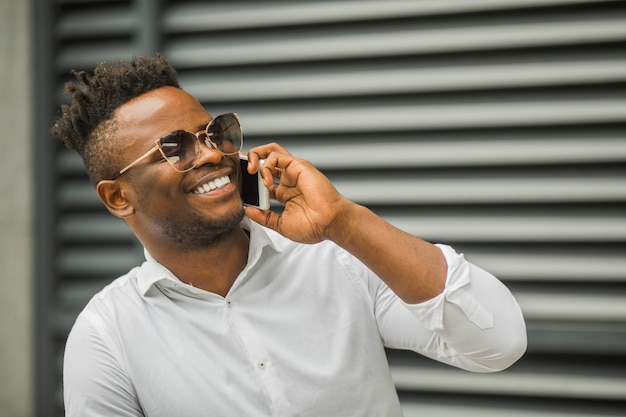 Handsome young African man in a white shirt