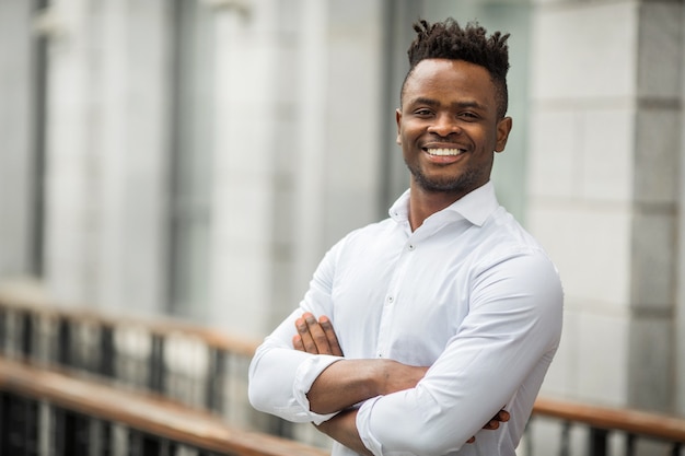 Handsome young African man in a white shirt