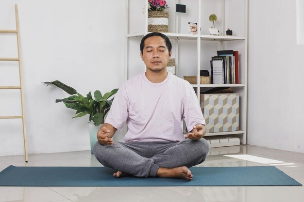 Handsome Young Asian Man Meditation At Home